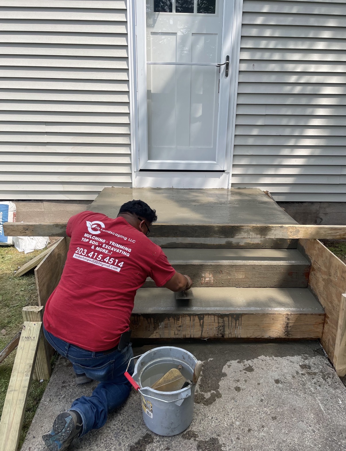 Pouring and finishing fresh concrete front steps